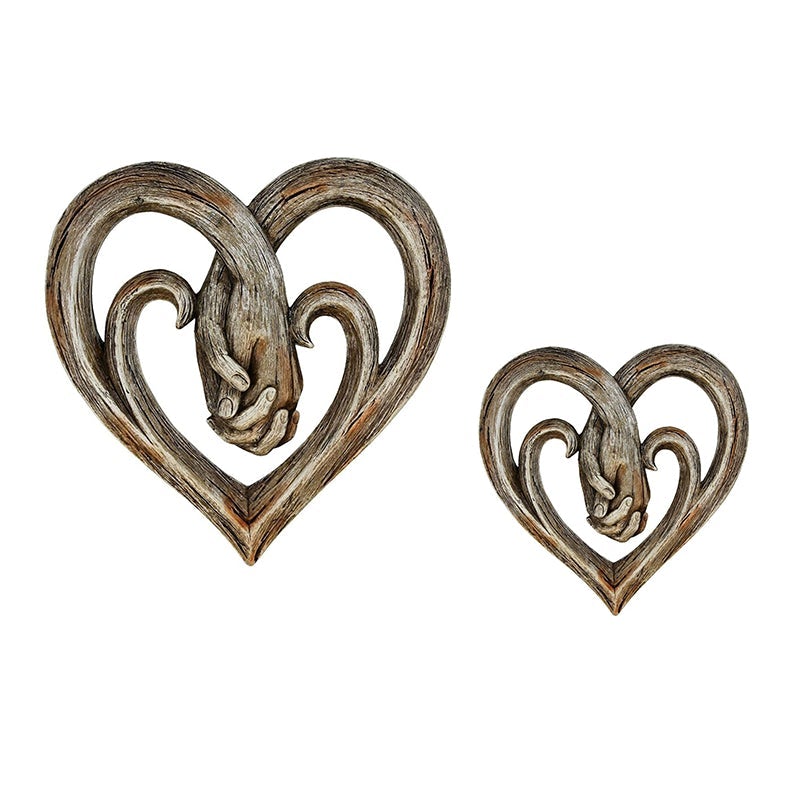Decorazione da parete con cuore che si tiene per mano