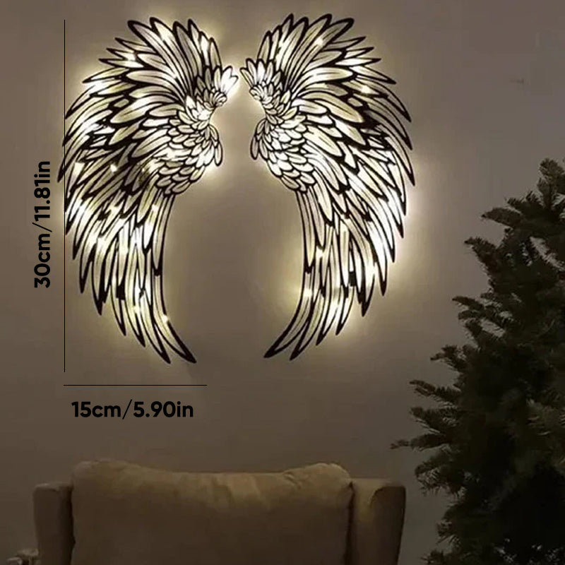 Ali d'angelo nere in metallo come arte da parete con luci a LED