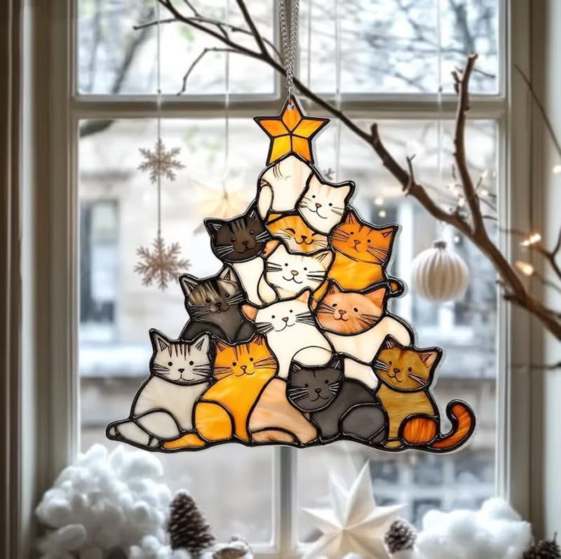 Gatto dell'albero di Natale che insegue il sole
