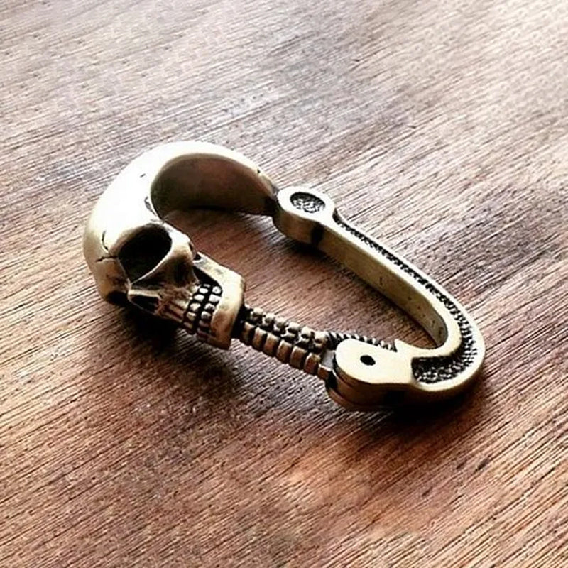 Nuovo moschettone a teschio con chiusura articolata della colonna cervicale