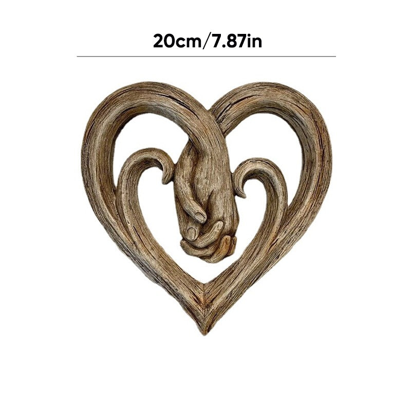 Decorazione da parete con cuore che si tiene per mano