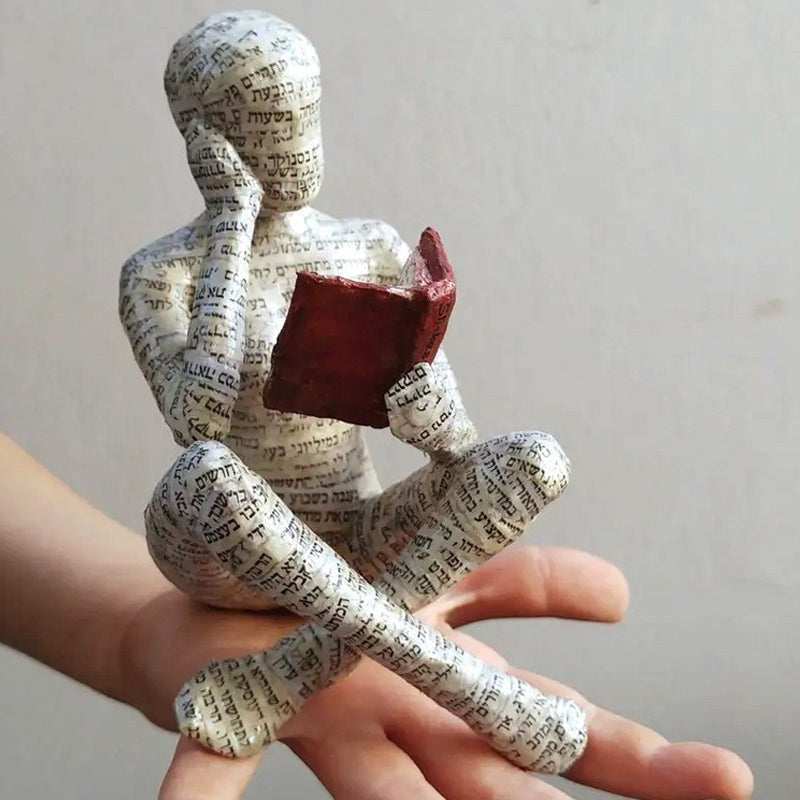 Artigianato di ornamenti in resina sotto forma di studioso