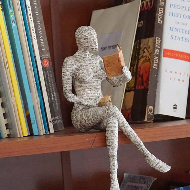 Artigianato di ornamenti in resina sotto forma di studioso