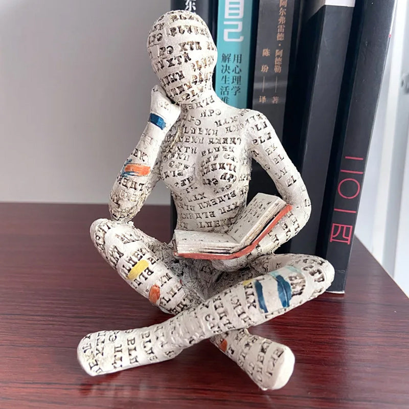 Artigianato di ornamenti in resina sotto forma di studioso