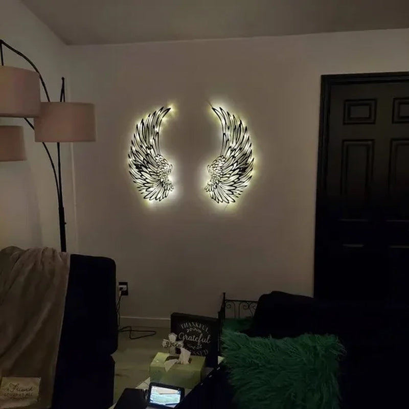 Ali d'angelo nere in metallo come arte da parete con luci a LED