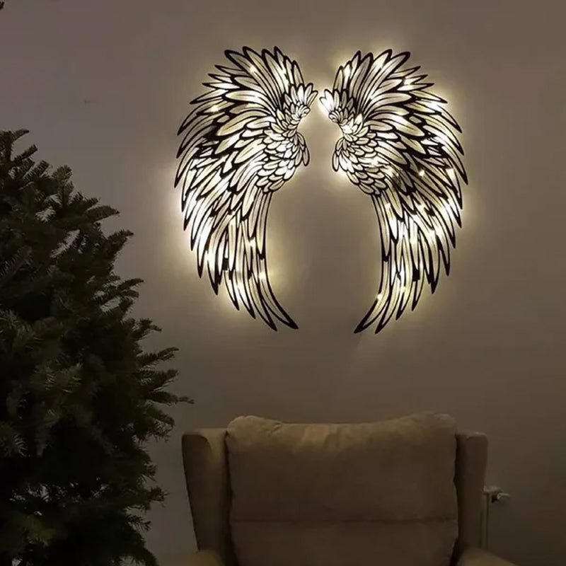Ali d'angelo nere in metallo come arte da parete con luci a LED