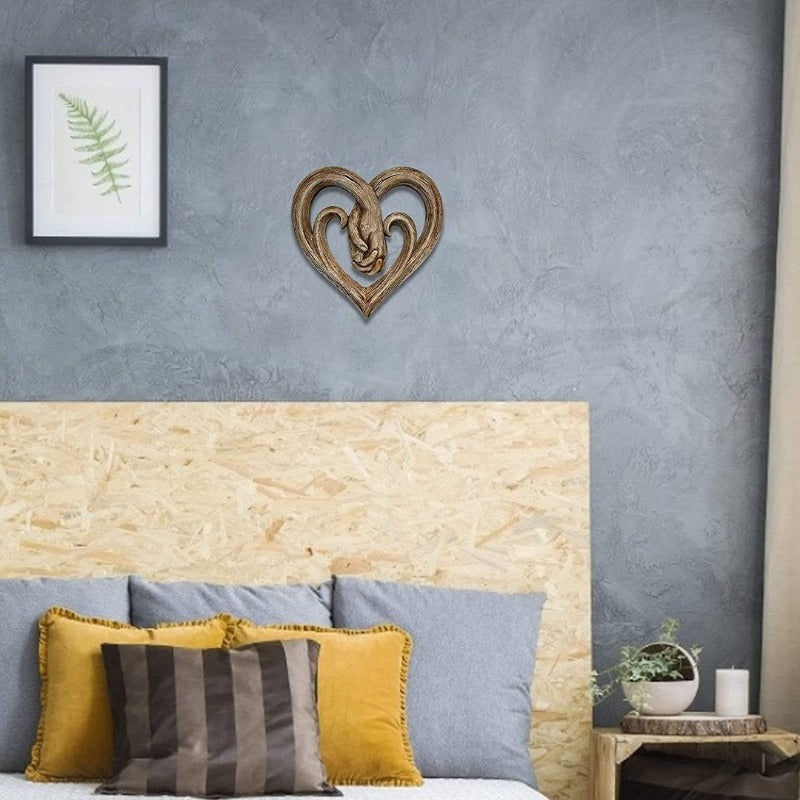 Decorazione da parete con cuore che si tiene per mano