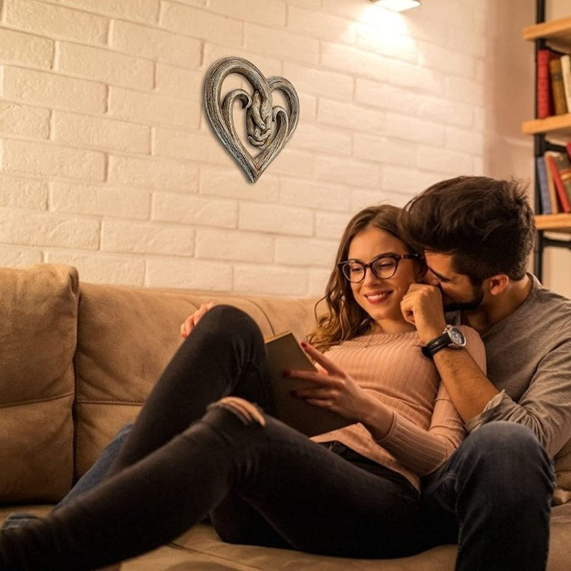 Decorazione da parete con cuore che si tiene per mano